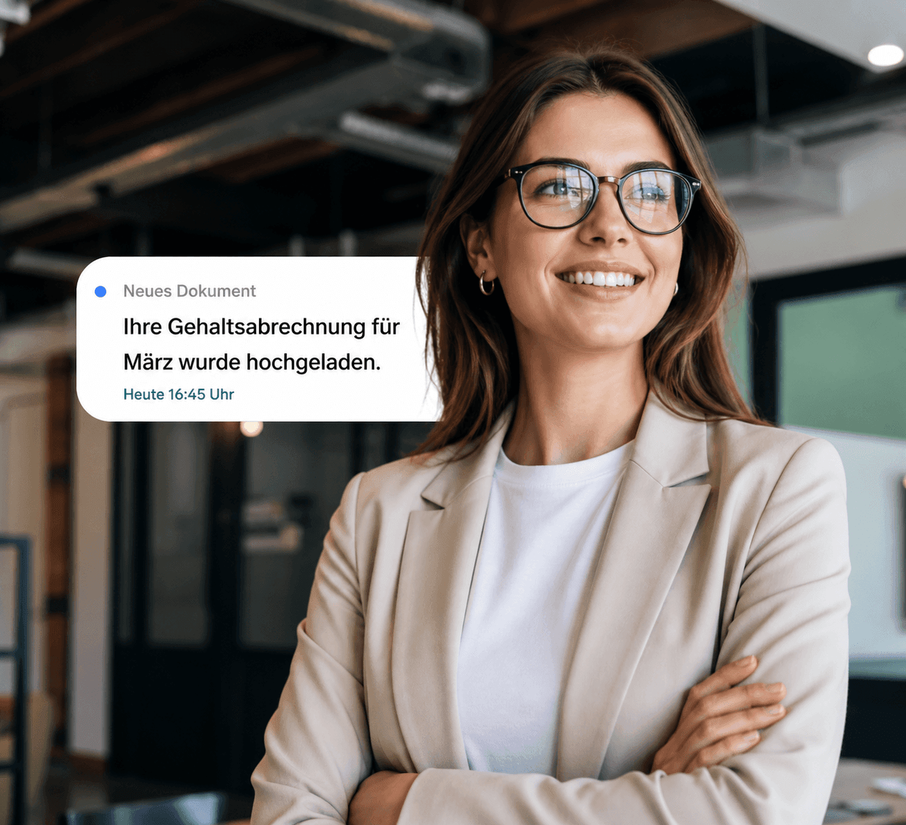 Smiling woman in an office looks at a notification: "Your payslip for March has been uploaded."