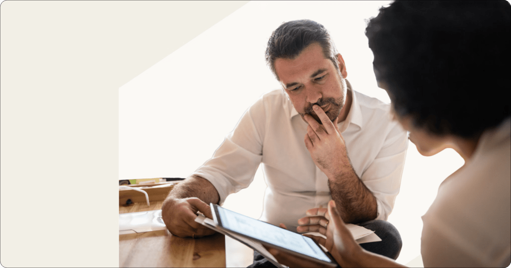 two office workers logging into a tablet device